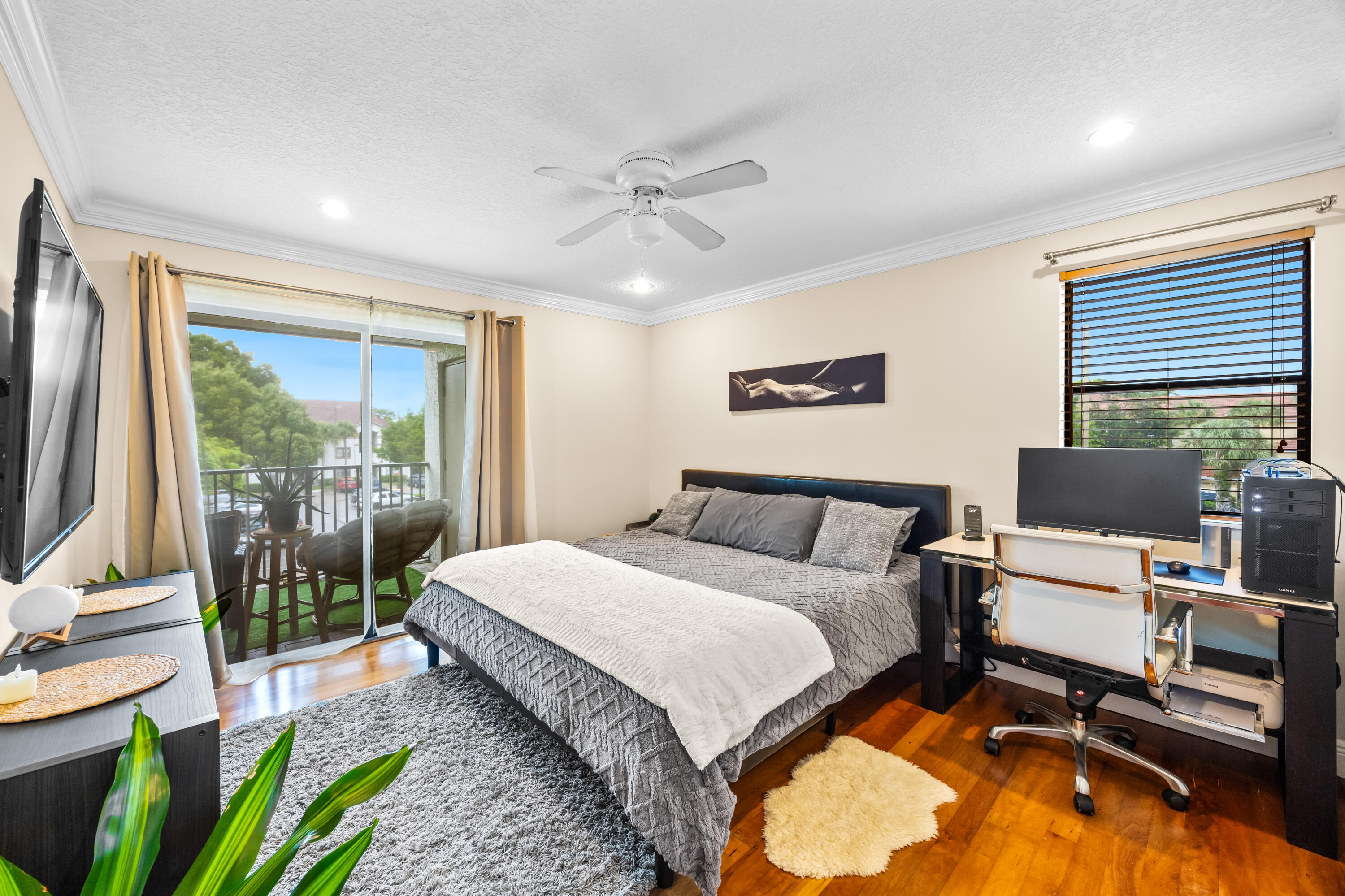 a spacious bedroom with a bed and large windows