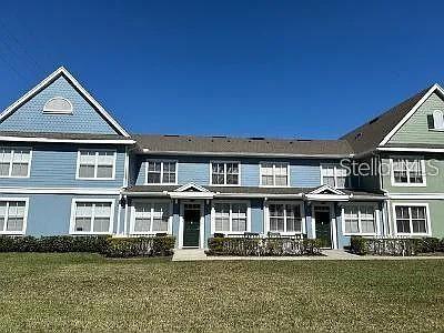 a front view of residential houses with yard