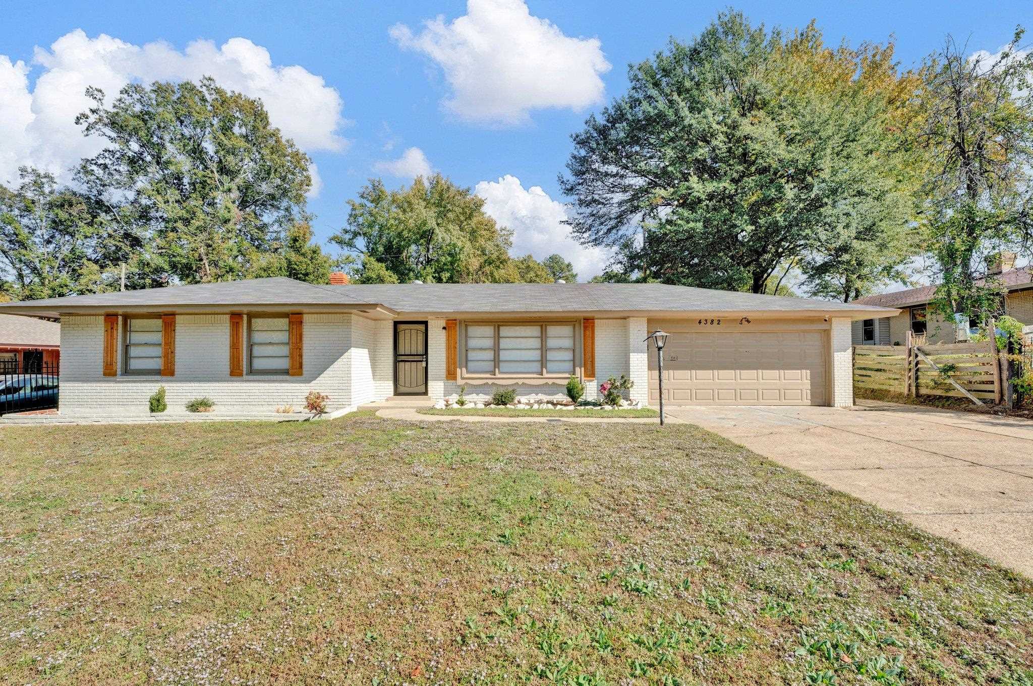 front view of a house with a patio