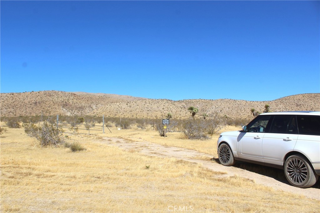 a view of car parked on the beach