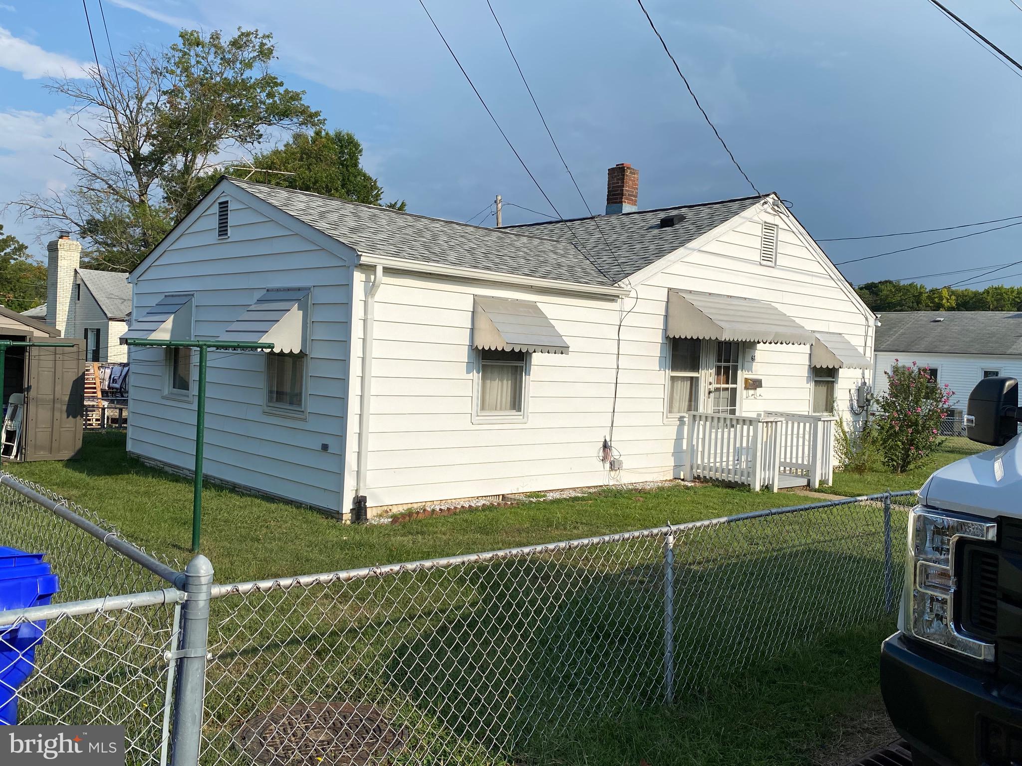 a view of a house with a backyard