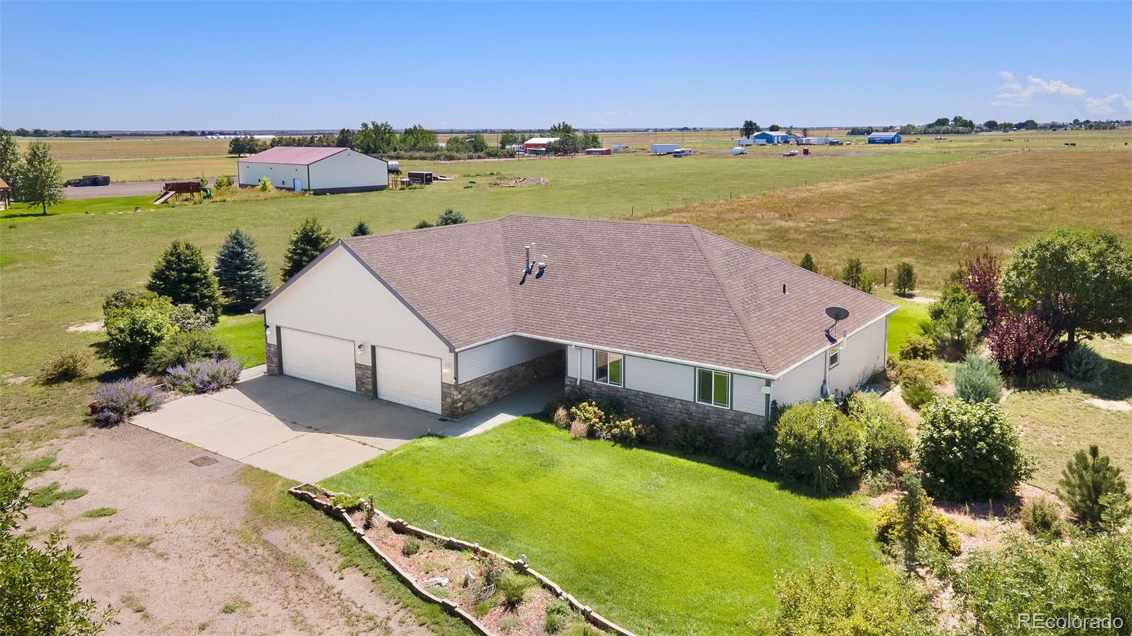 an aerial view of a house with a lake view