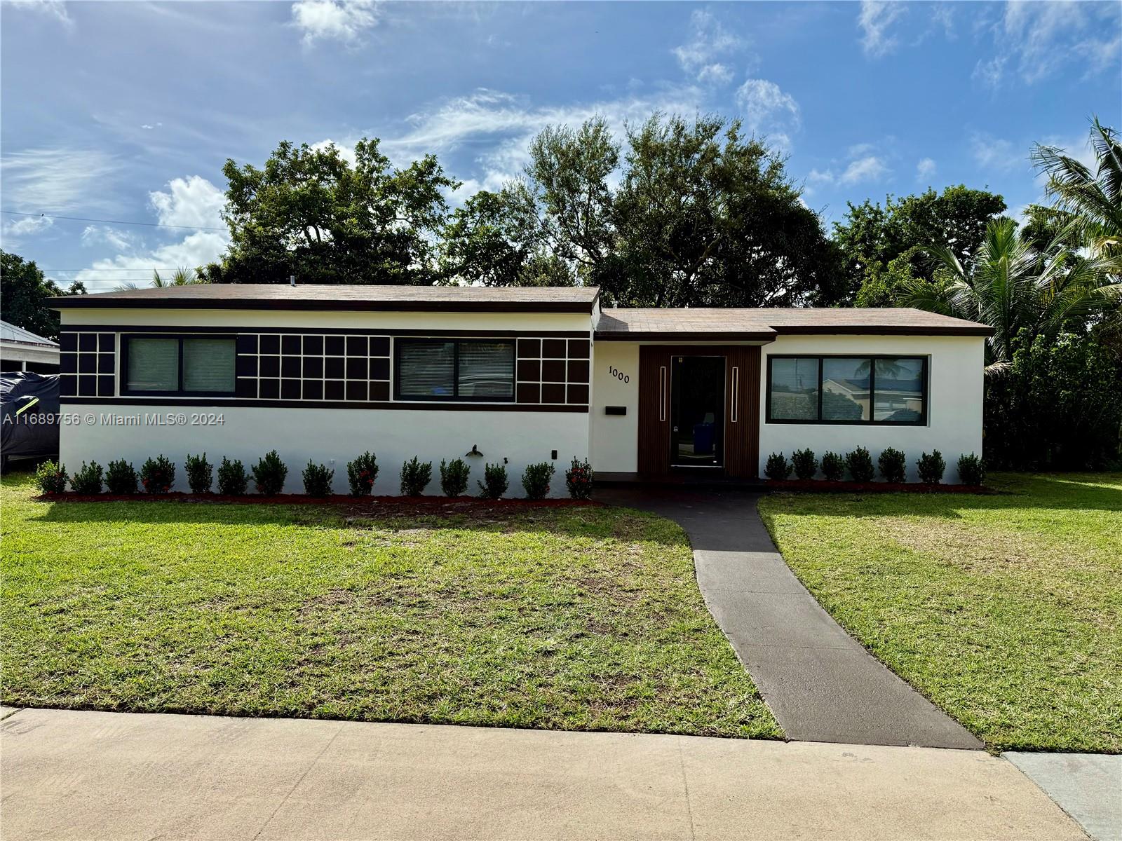 front view of a house with a yard