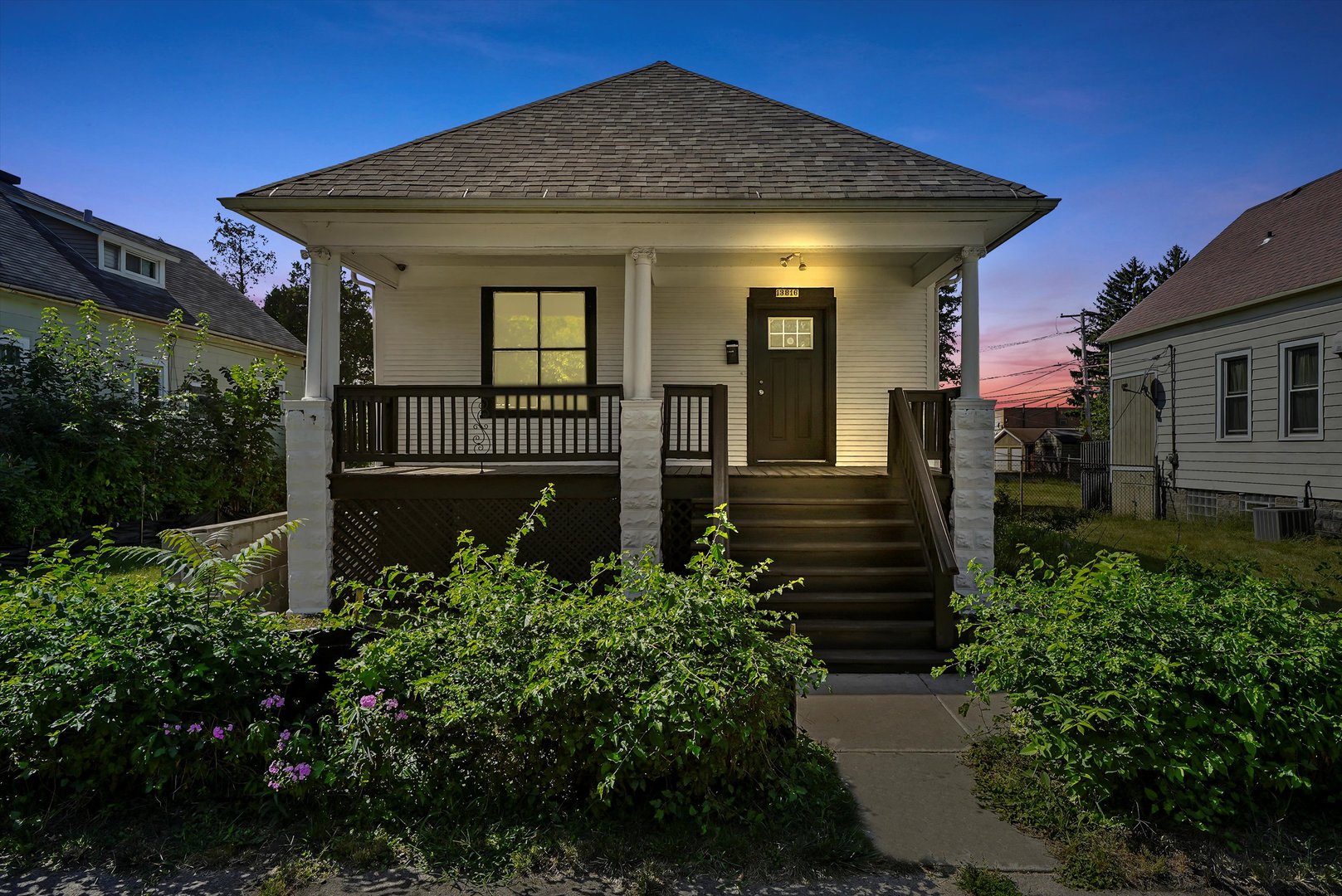 a front view of a house with garden