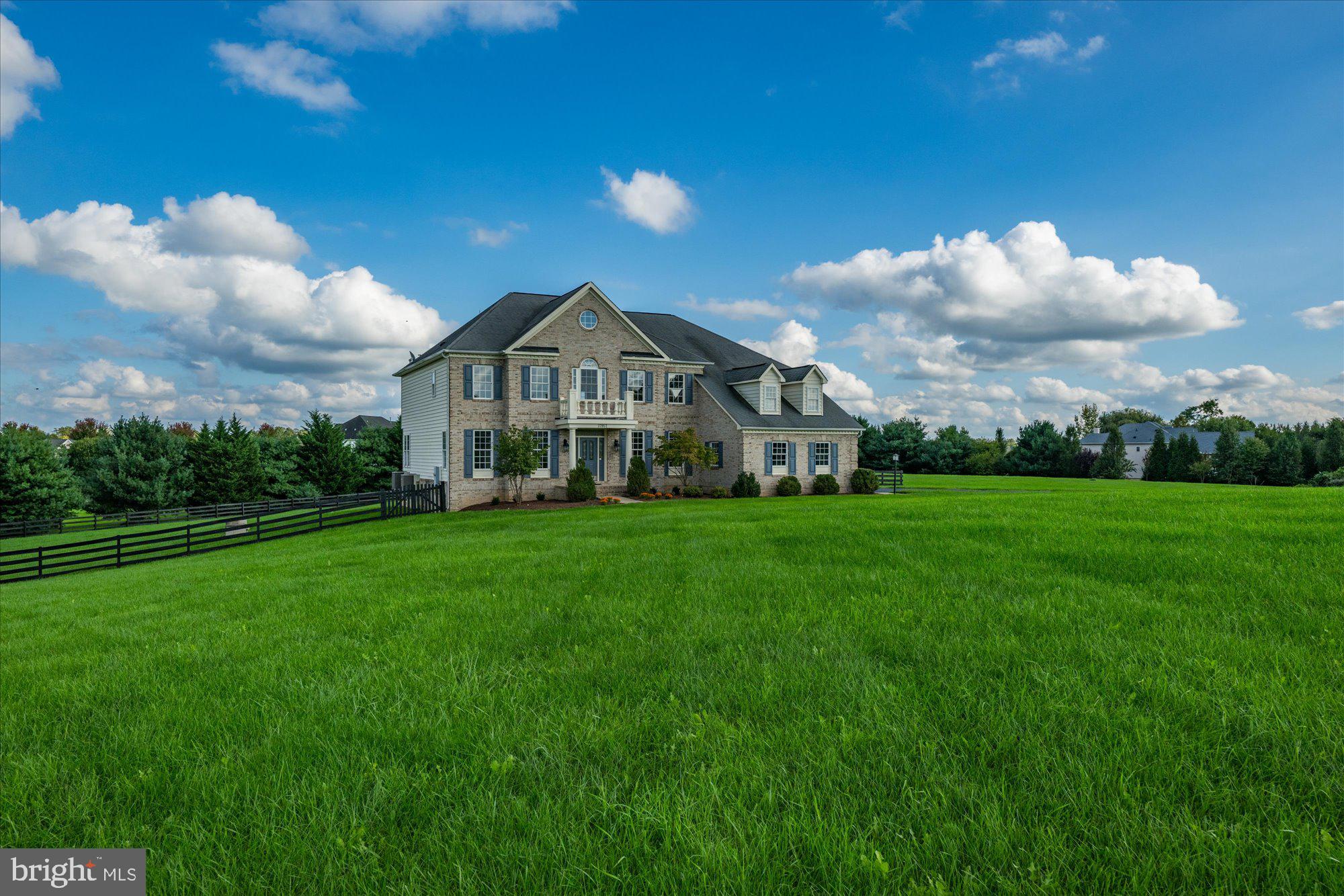 a view of a house with a big yard