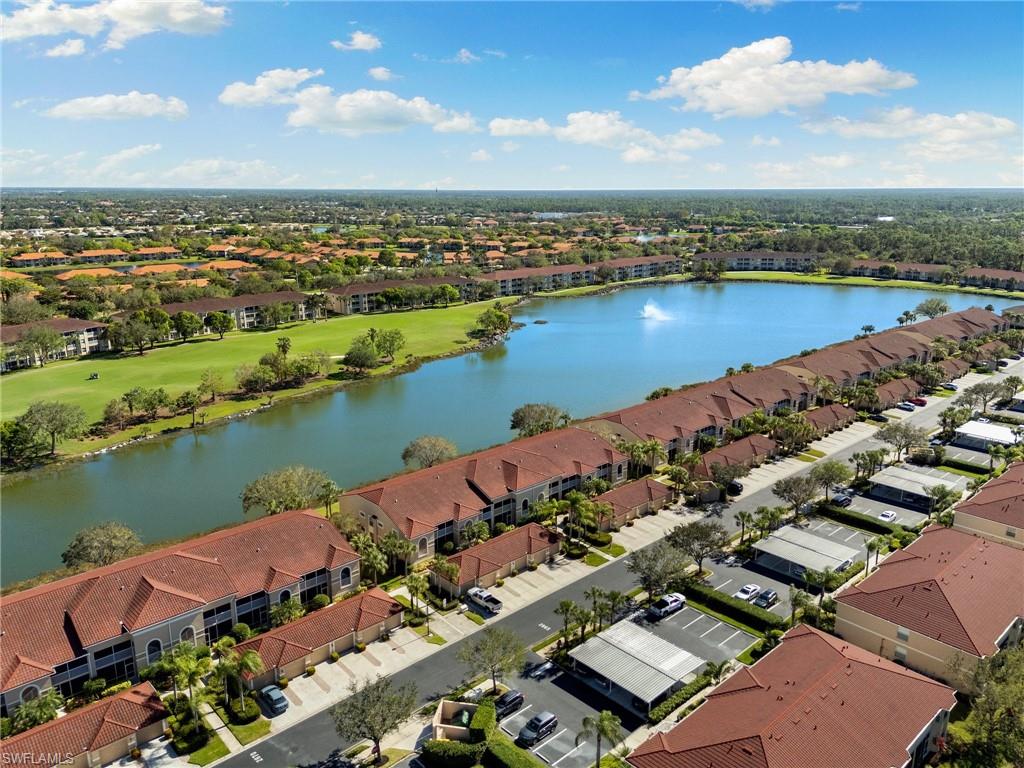 an aerial view of a city with lake view