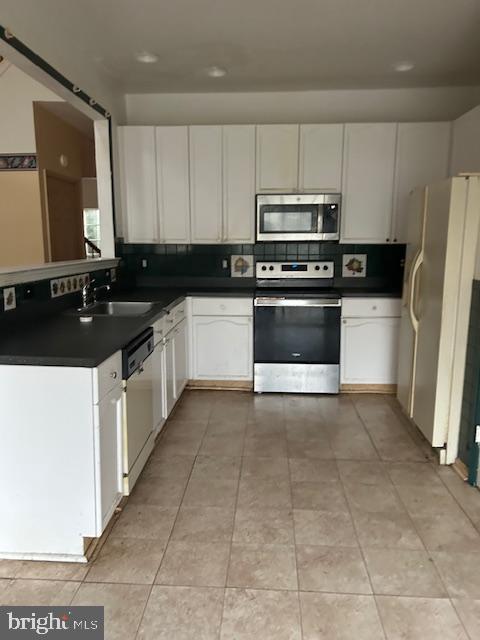 a kitchen with a sink a stove and refrigerator