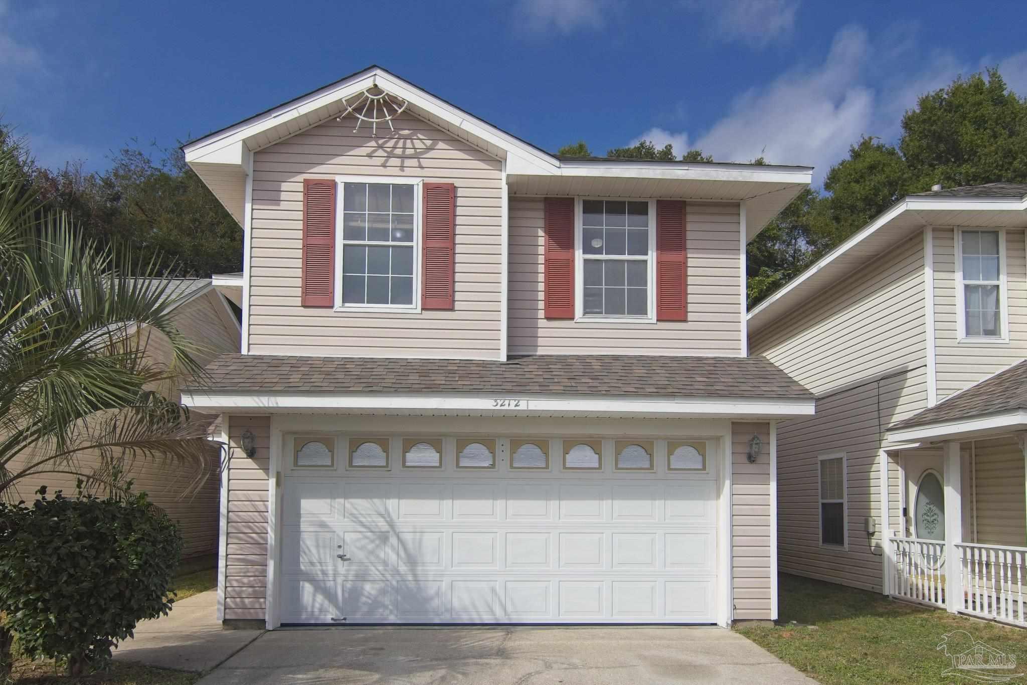 a front view of a house with yard