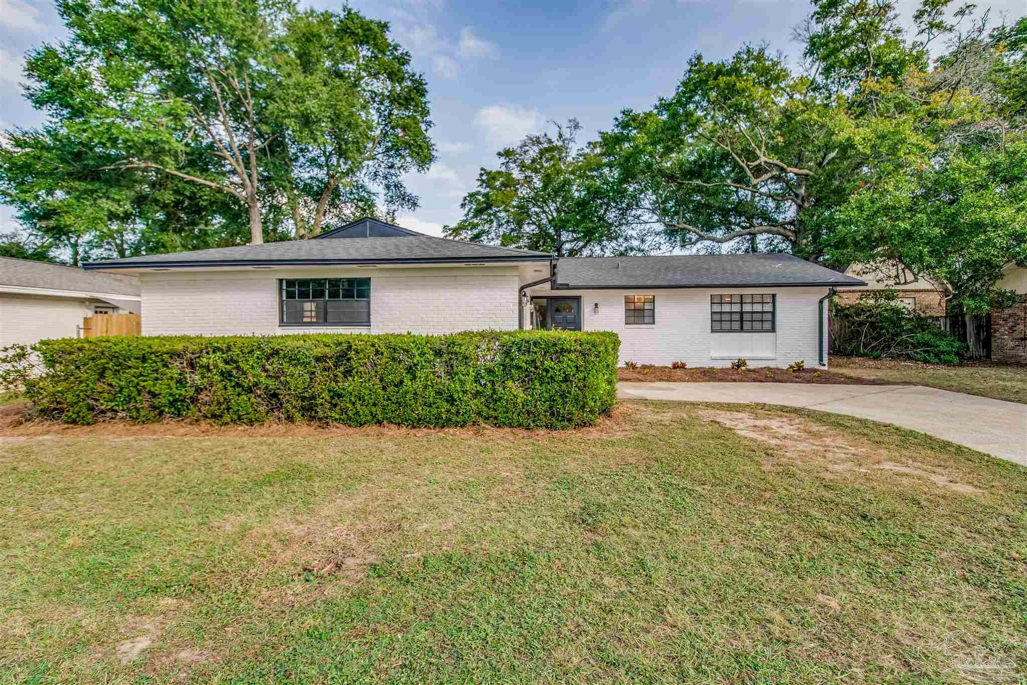 front view of a house with a yard