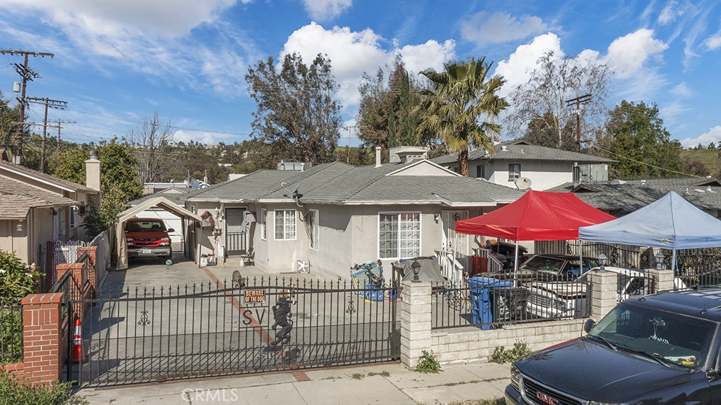 a front view of a house with yard and patio