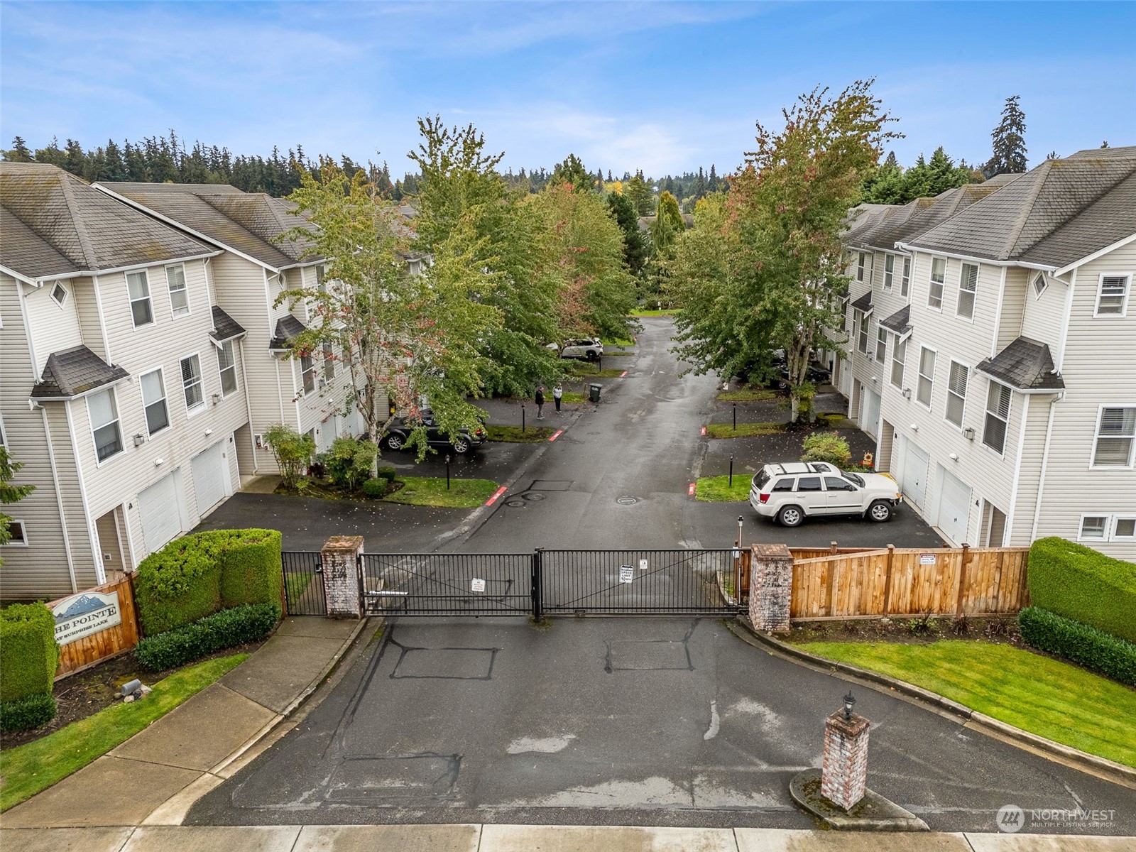 a aerial view of a house with a yard