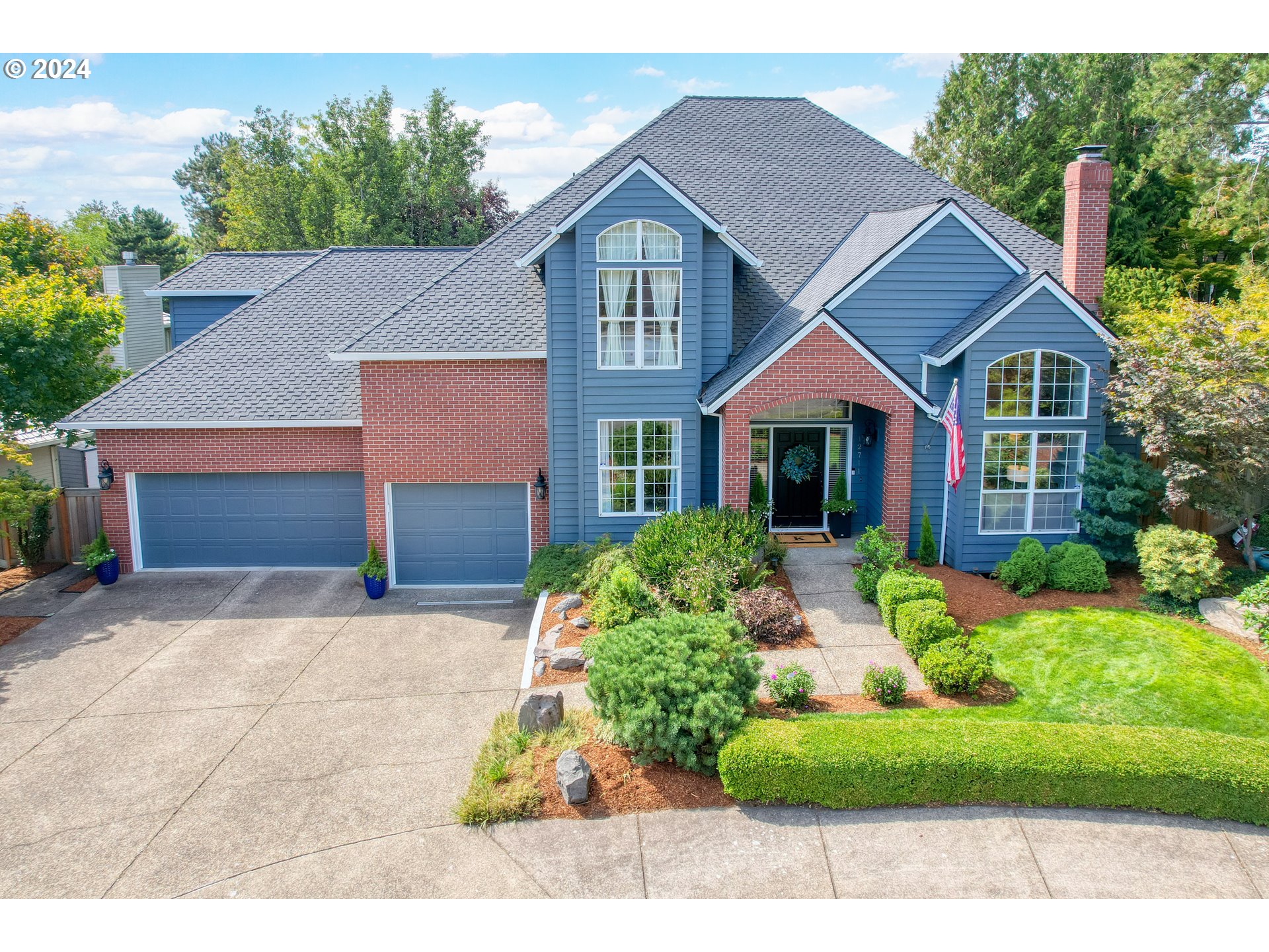 a front view of a house with a yard