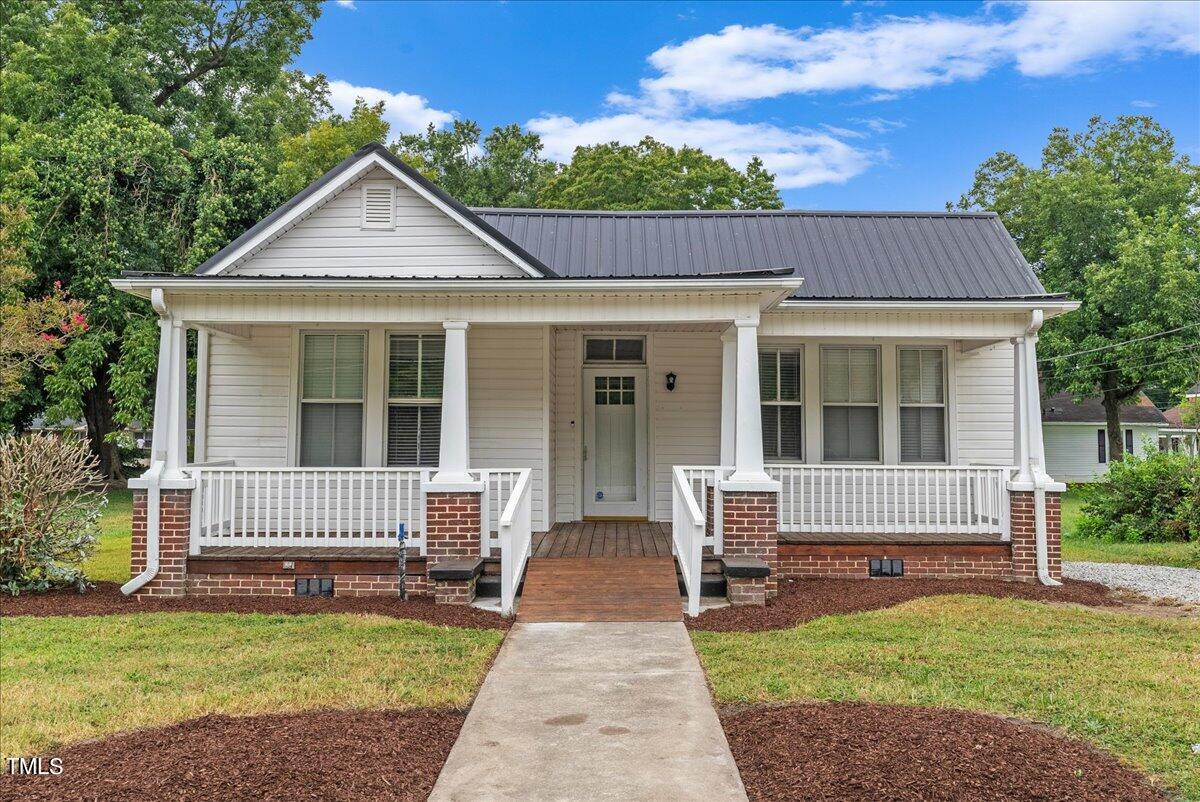 front view of a house with a yard