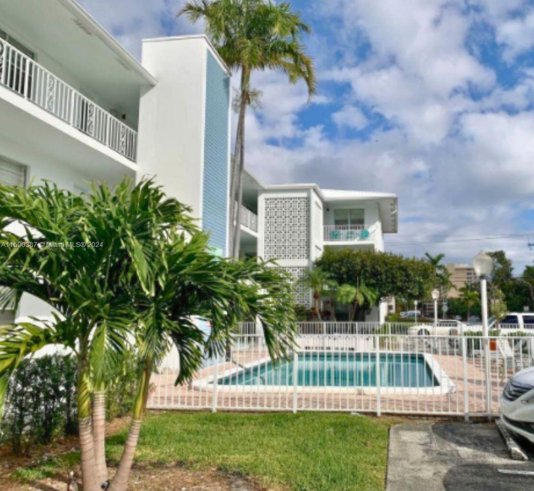 a view of house with backyard and garden