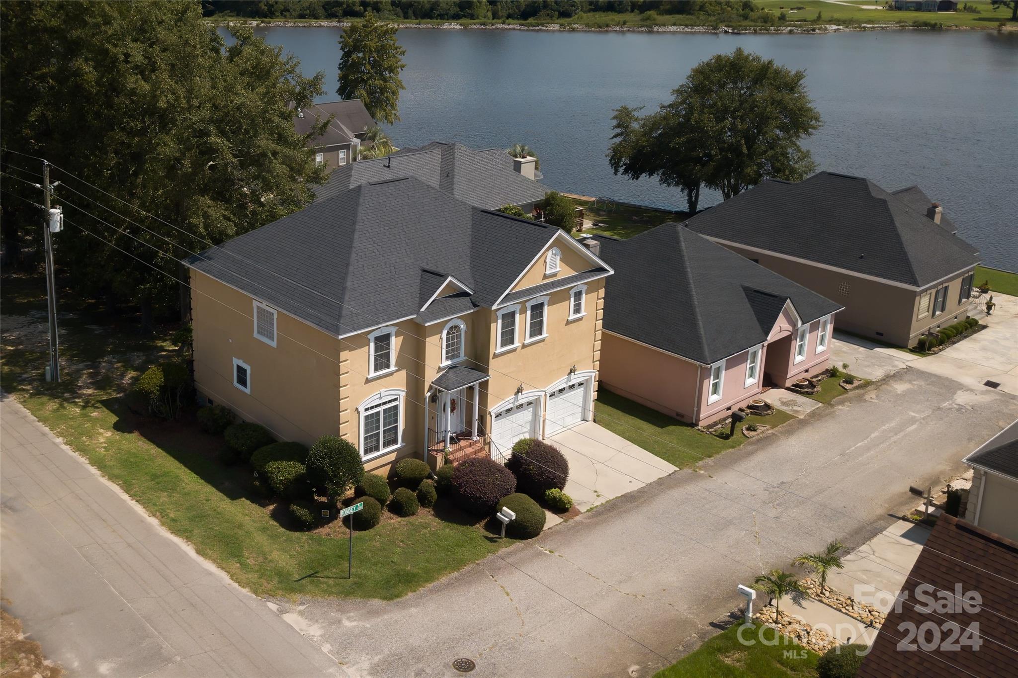 an aerial view of a house with lake view