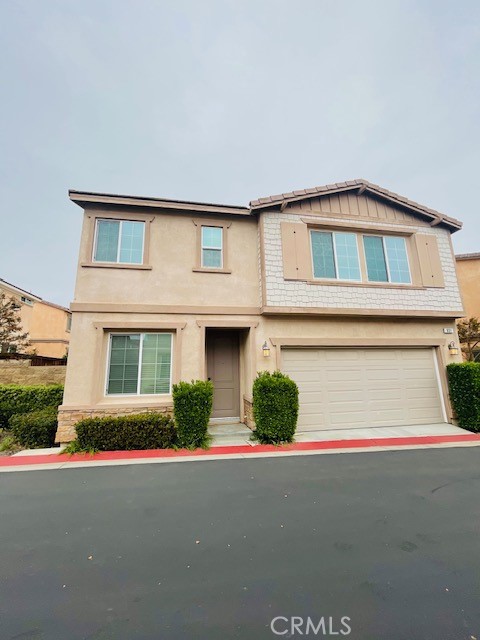 a front view of a house with garage