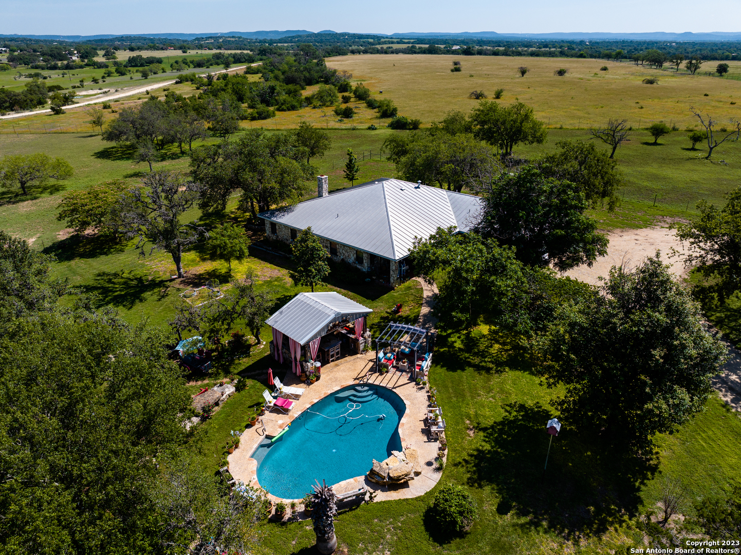 an aerial view of a house with a lake view