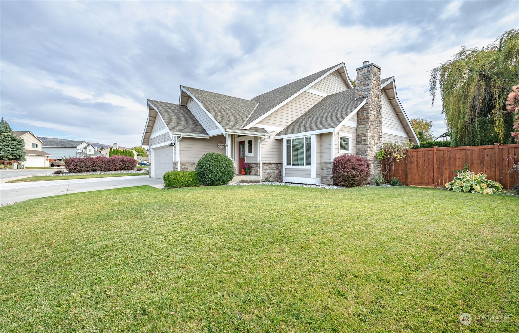 a front view of house with yard and green space