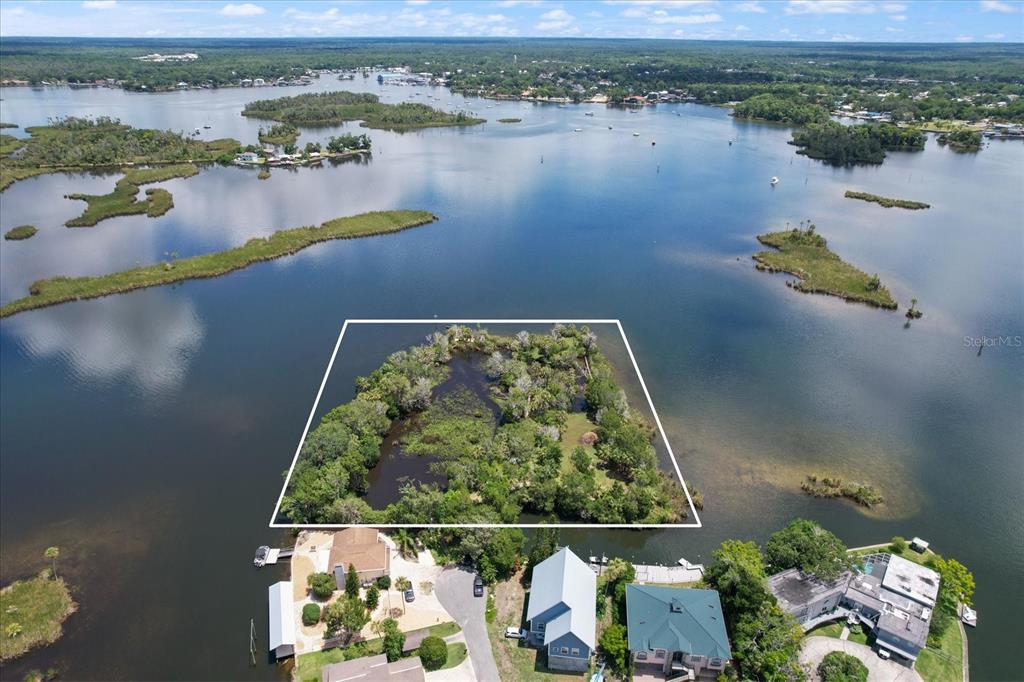 an aerial view of lake residential house with outdoor space