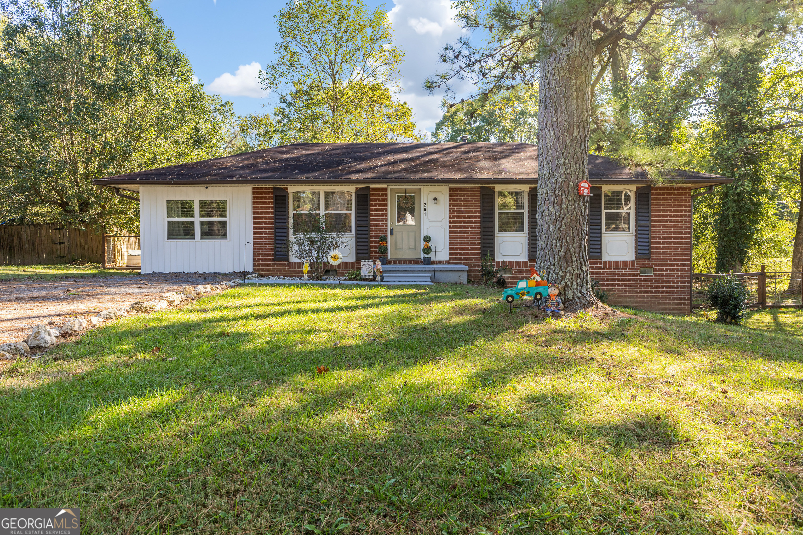 a view of a house with a yard patio and a yard