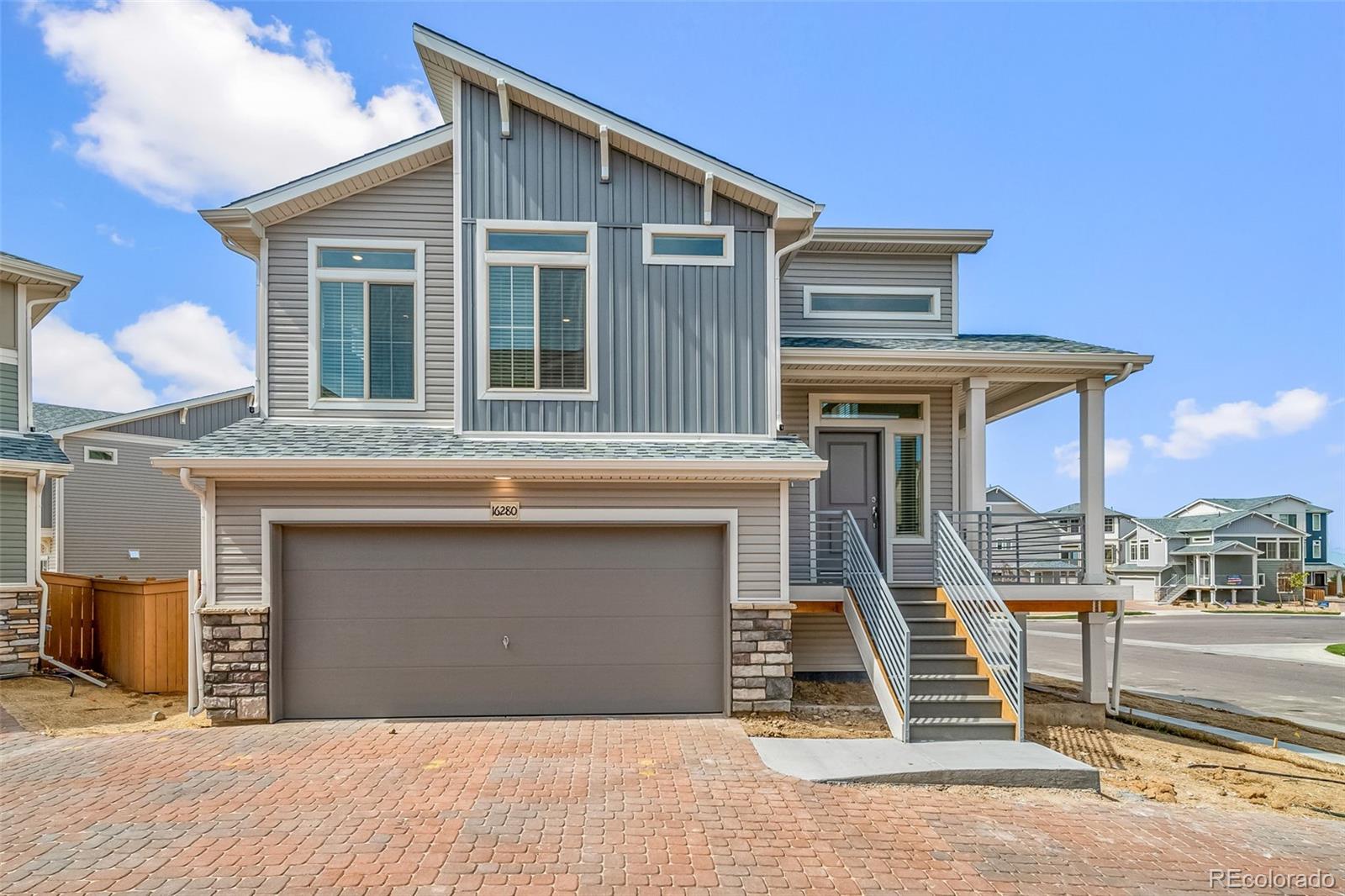 a front view of a house with a garage