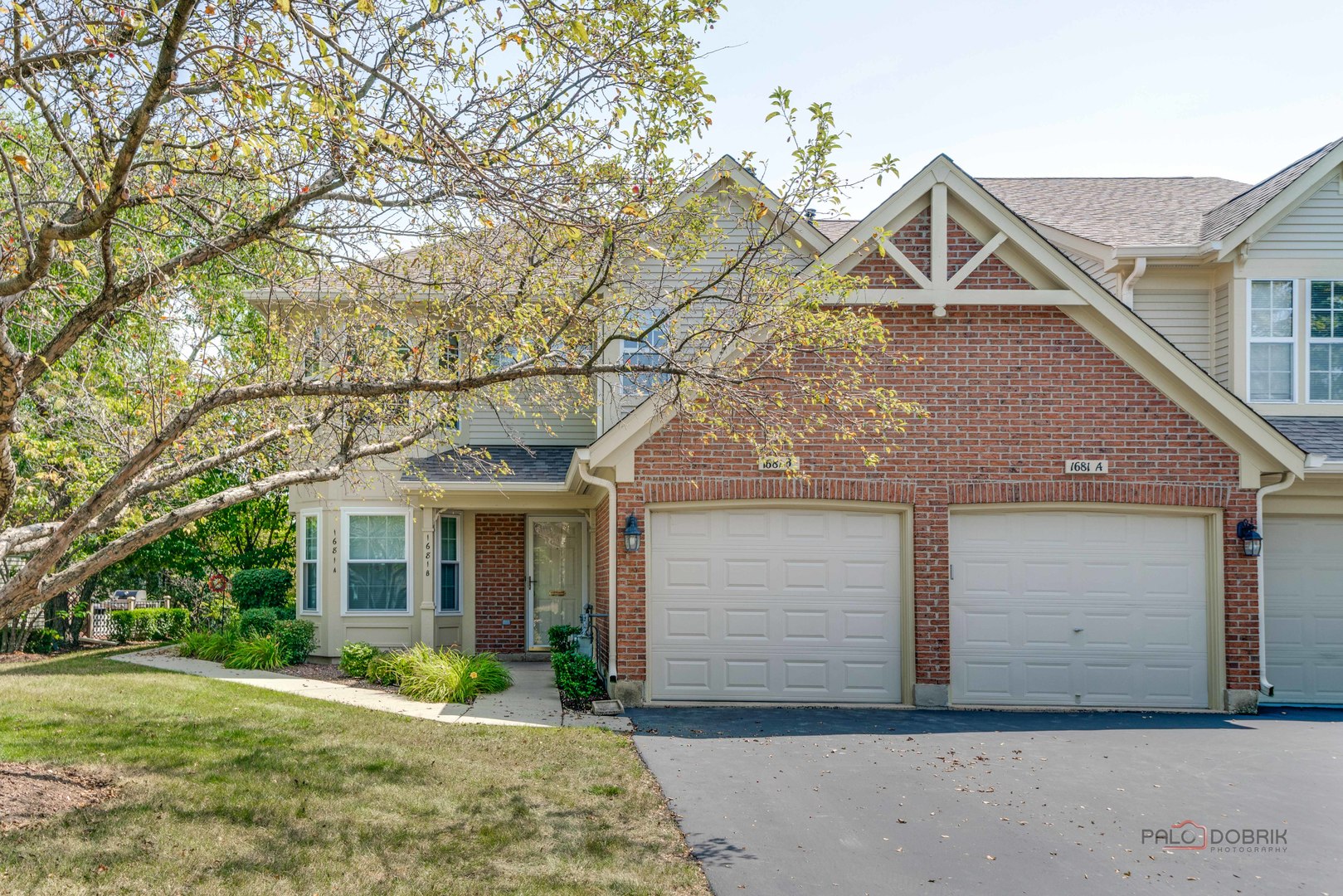 front view of a house with a yard