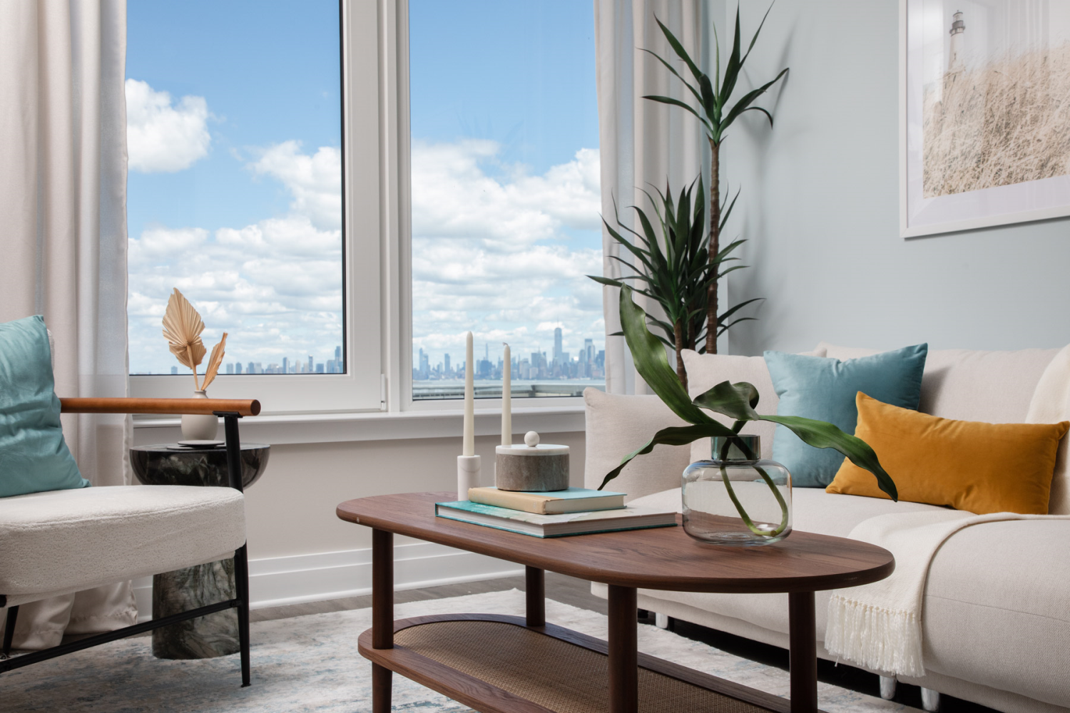 a living room with furniture and a potted plant