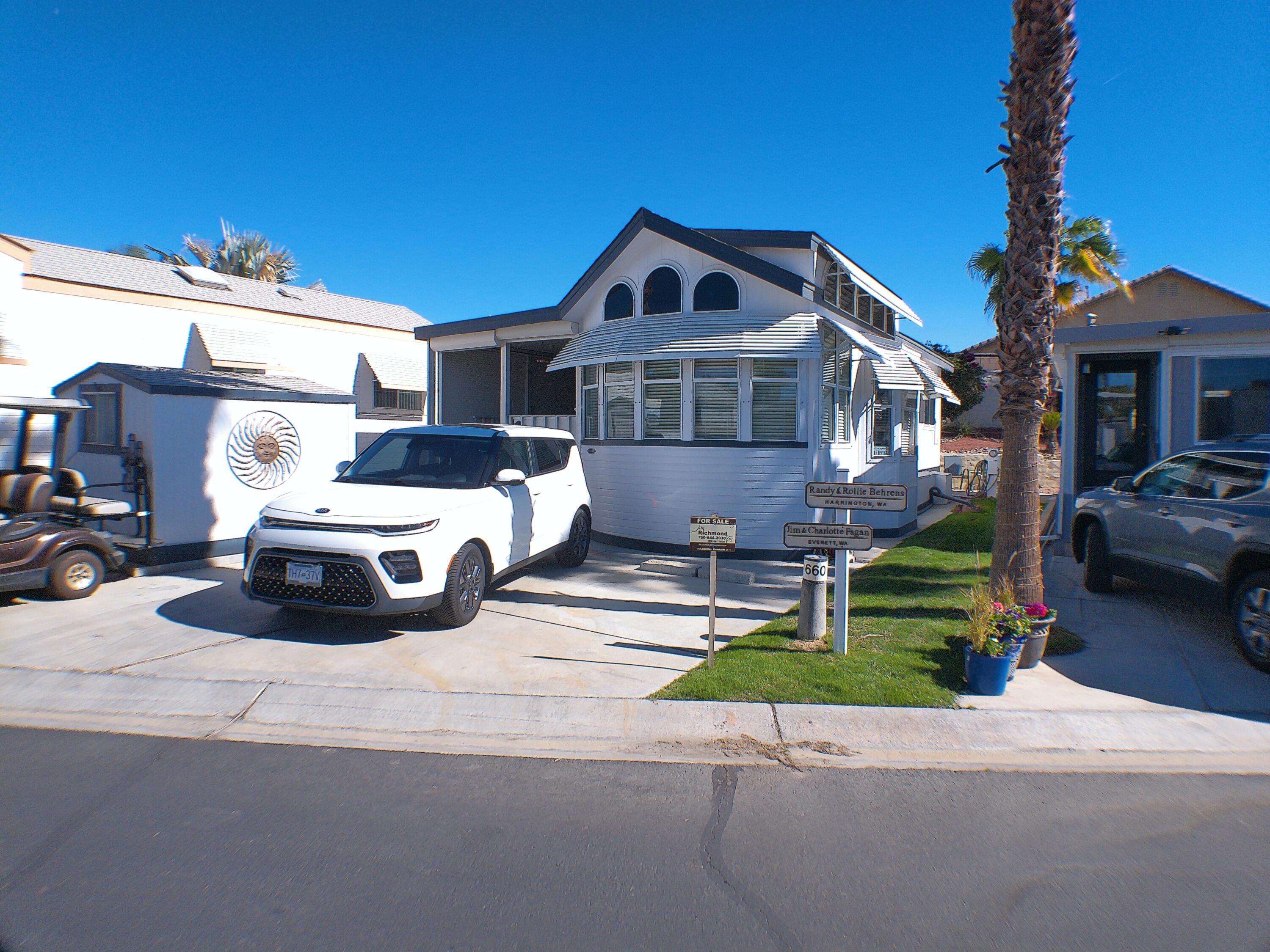 a view of a car parked in front of a house