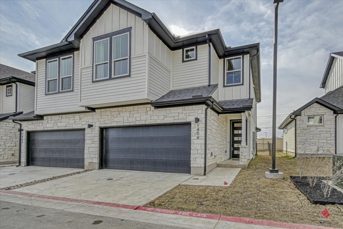 a front view of a house with a garage