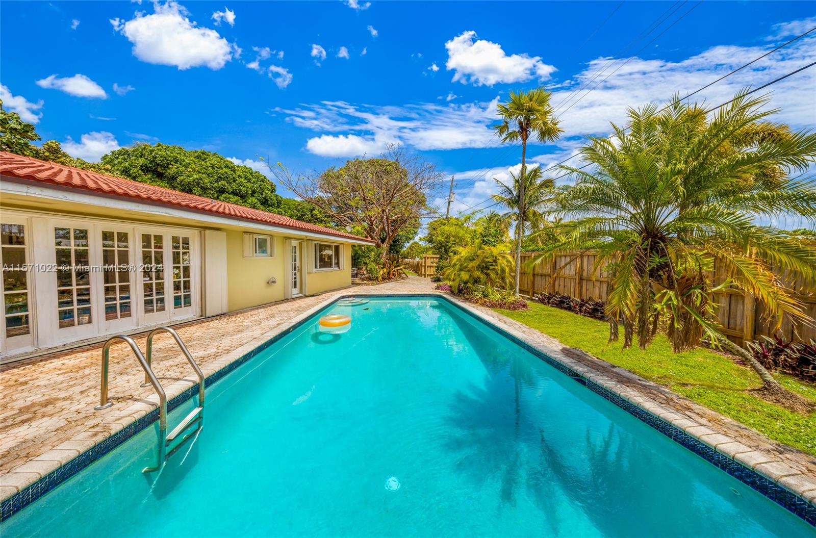 a view of swimming pool with a backyard