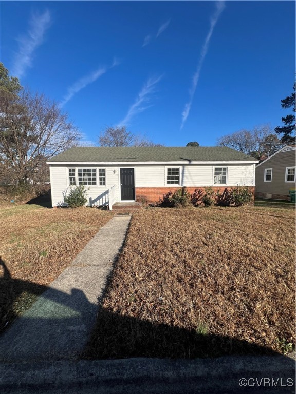 Single story home featuring a front yard