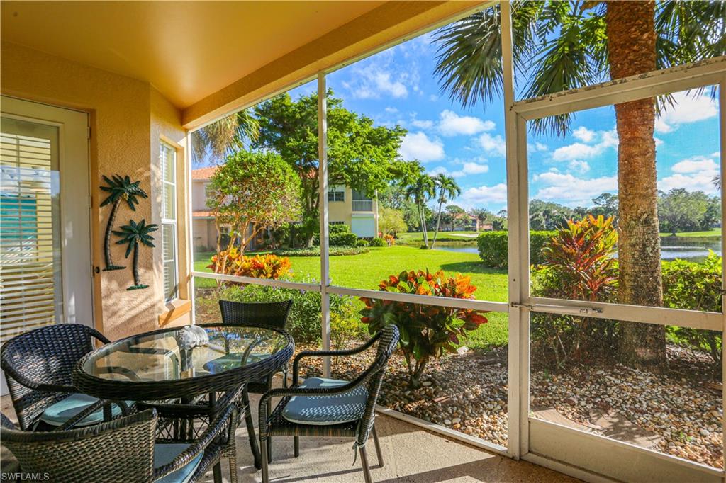 a view of a porch with furniture and yard