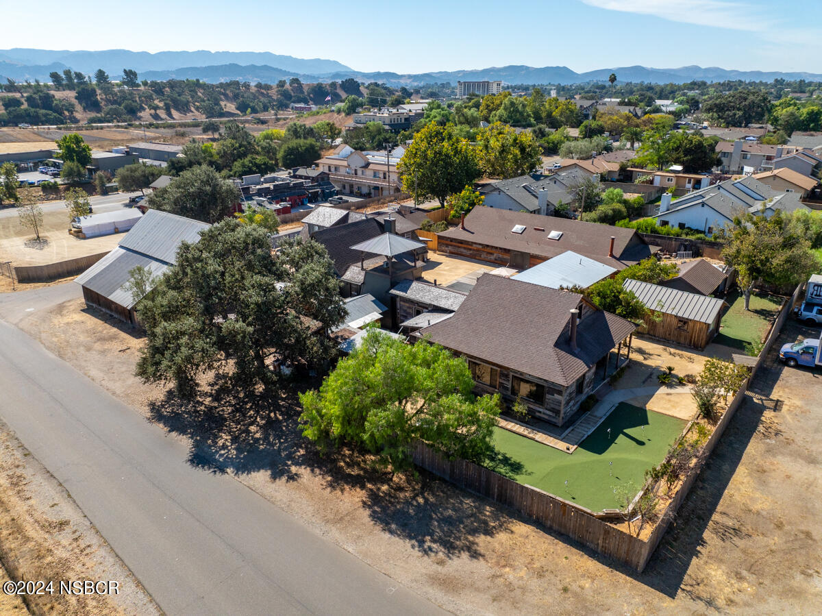 an aerial view of a house with a garden