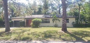 a view of house with yard in front of house