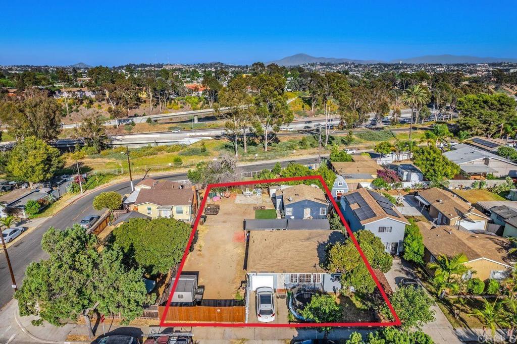 an aerial view of residential houses with outdoor space