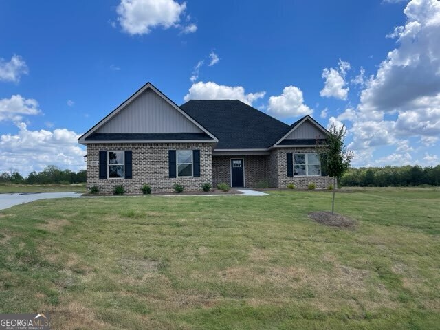 a front view of a house with a yard