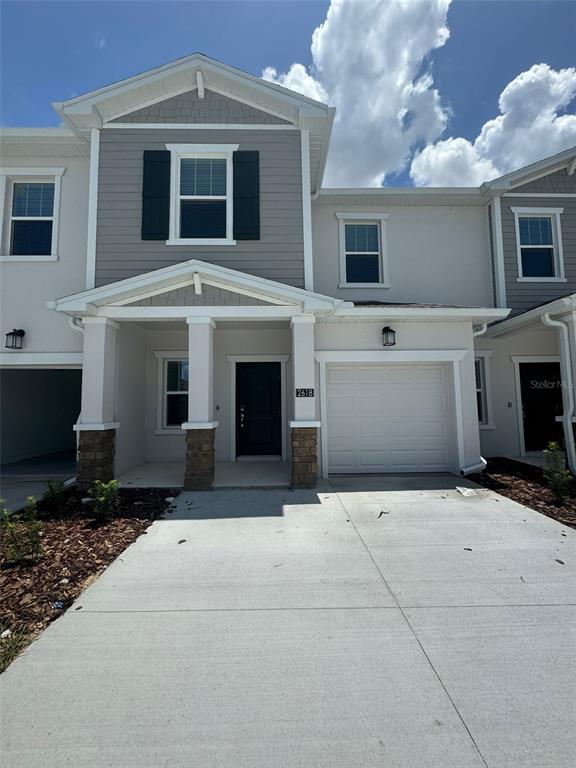 a front view of a house with a garage