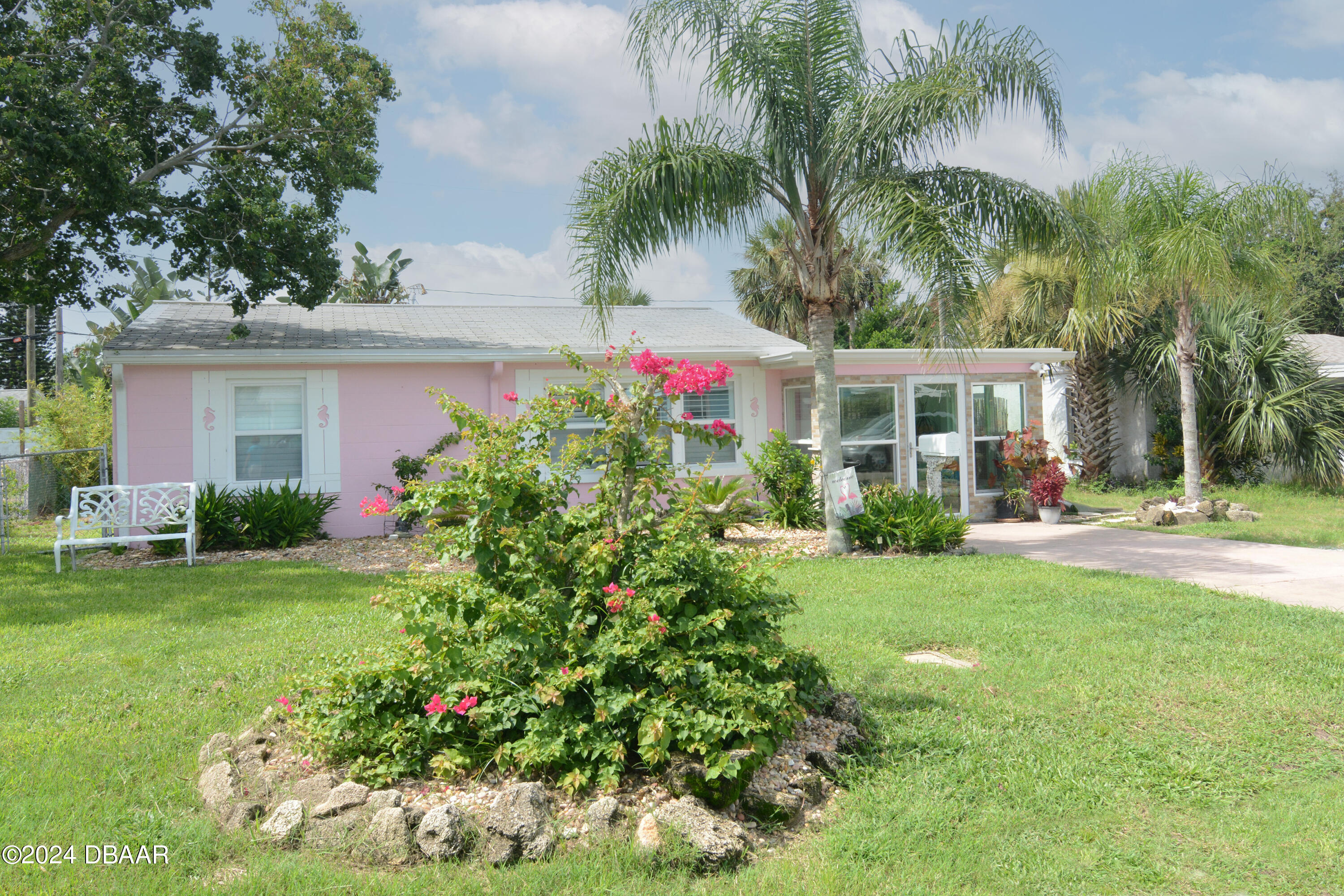 a house view with a garden space