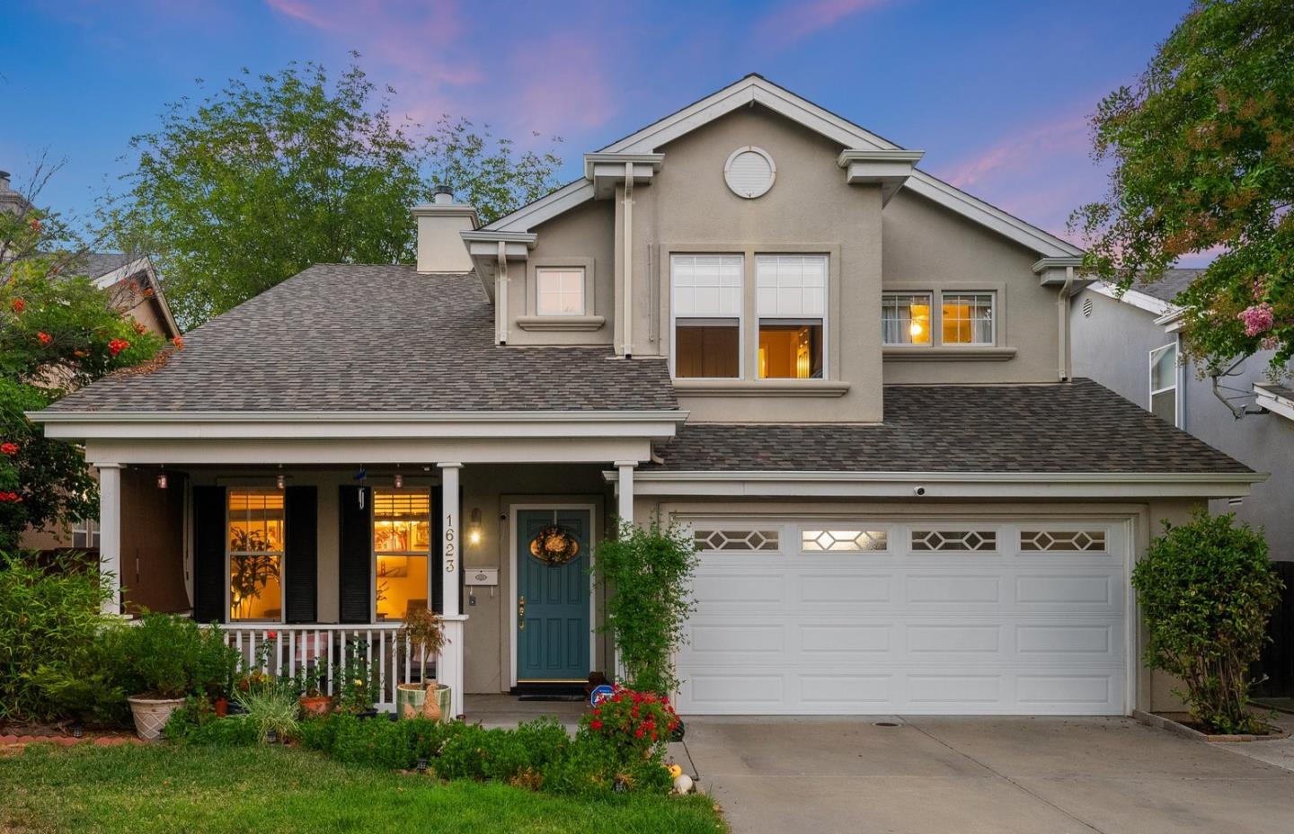 a front view of a house with yard