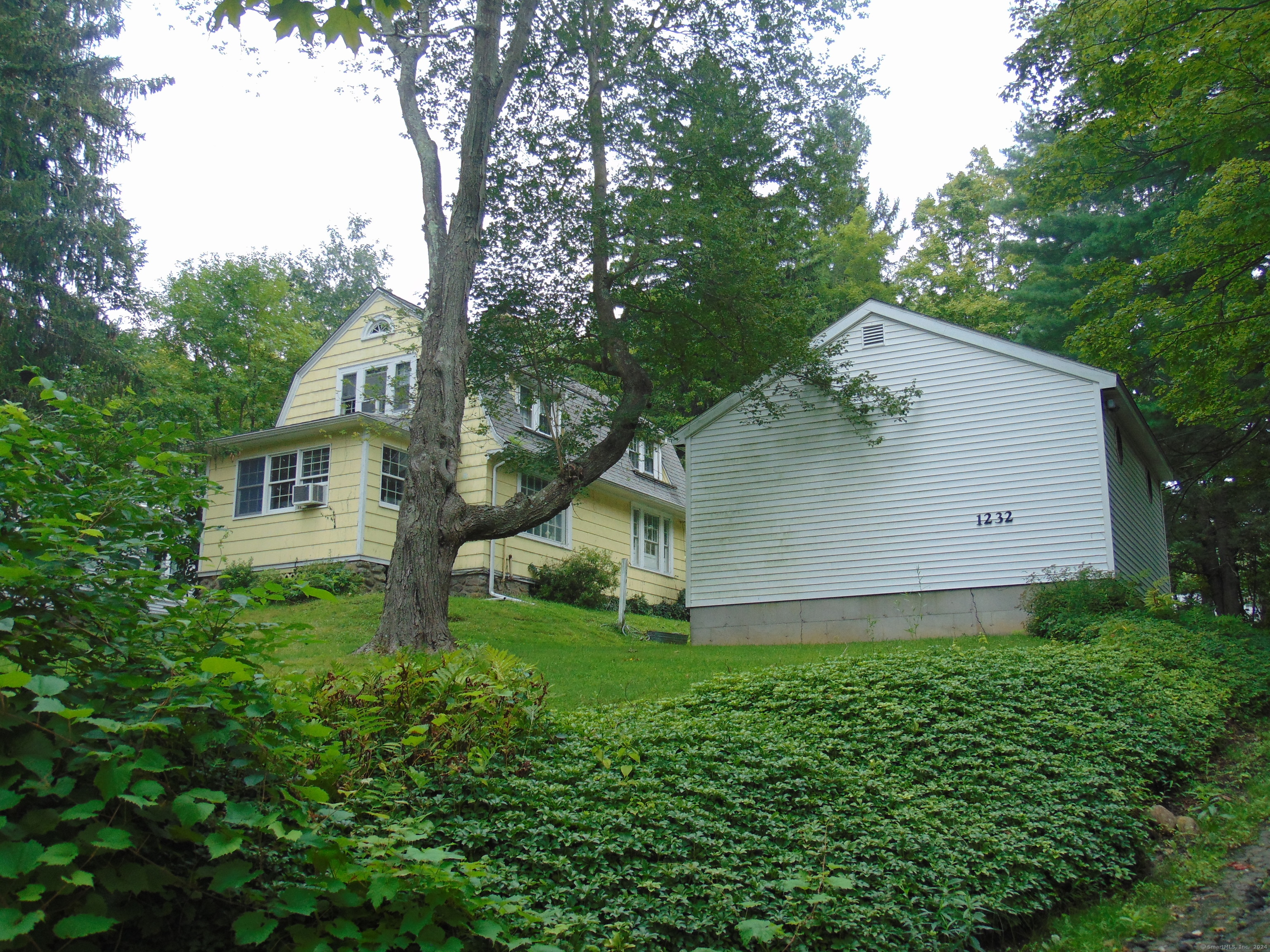 front view of a house with a yard