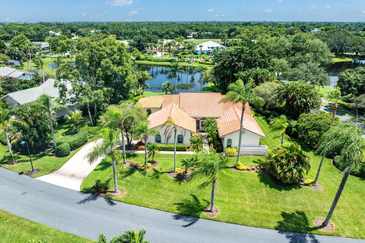 an aerial view of a house with a garden