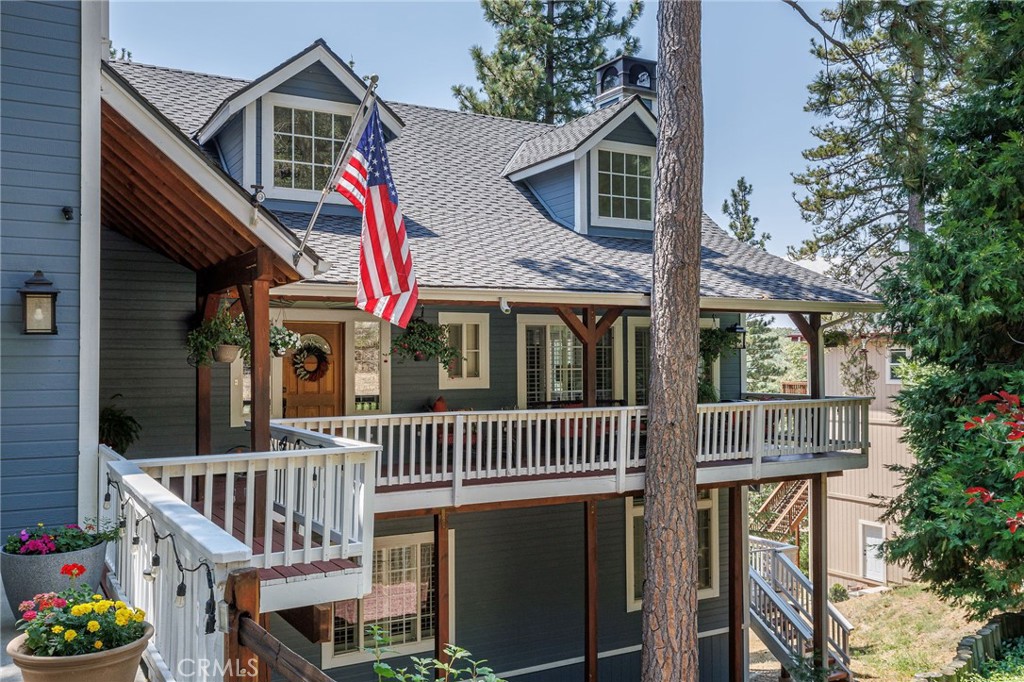 a front view of a house with a deck