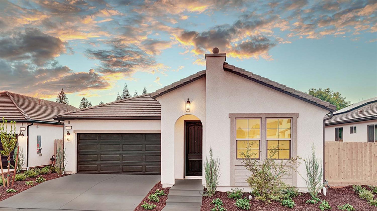 a front view of a house with a garage