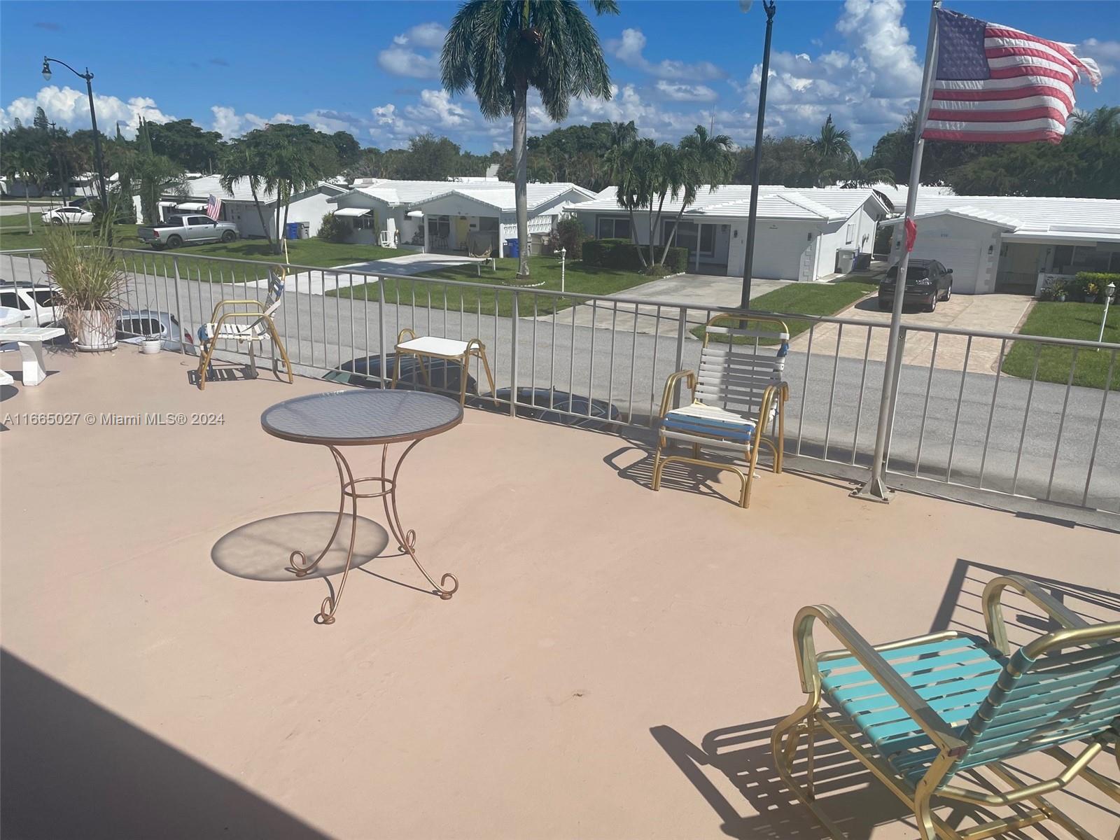 a view of a terrace with furniture