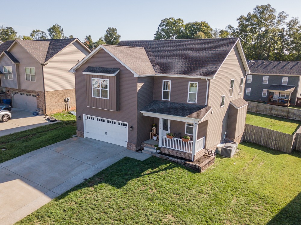 a aerial view of a house with a yard