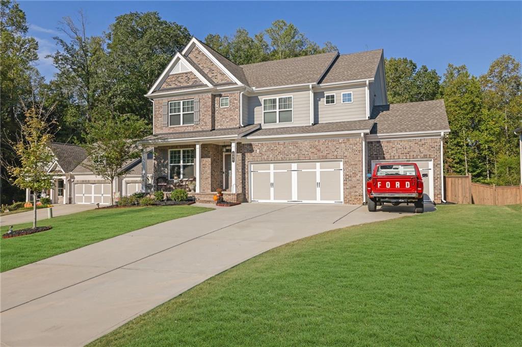 front view of a house with a yard