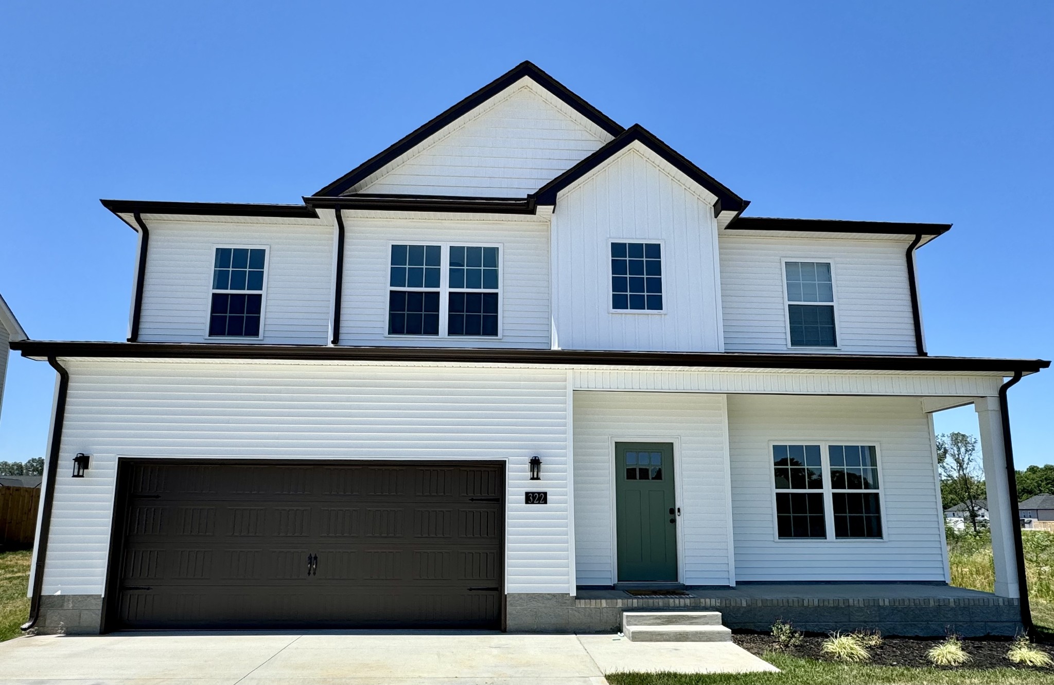 a front view of a house with garage