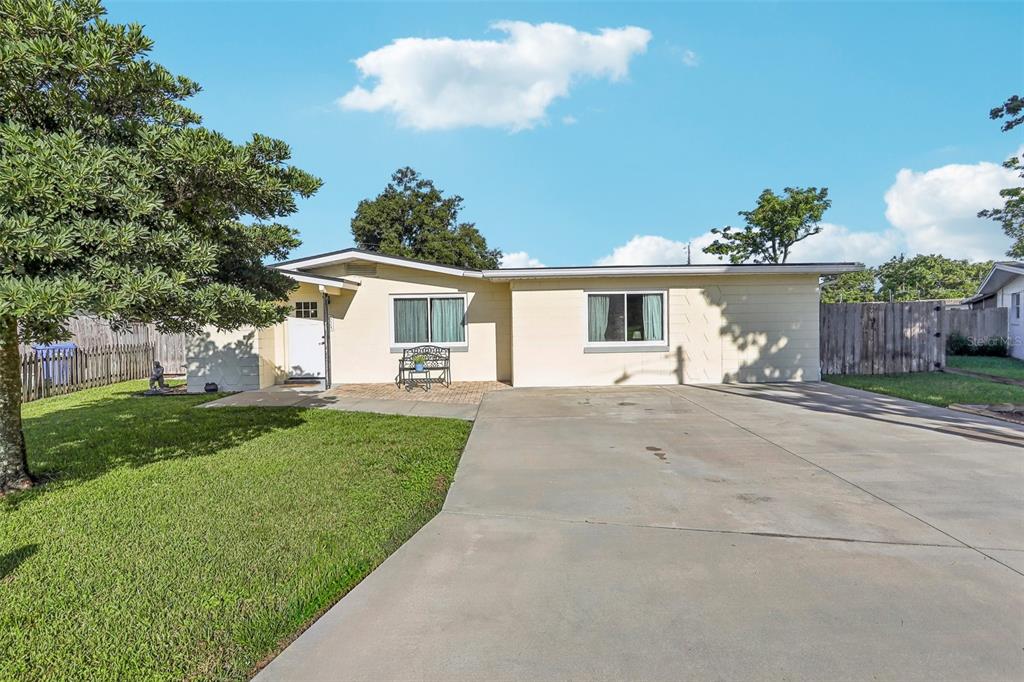 front view of a house with a yard