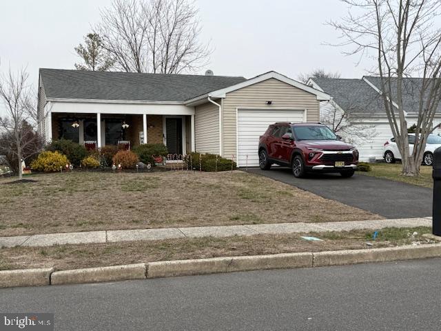 a view of a car parked in front of a house