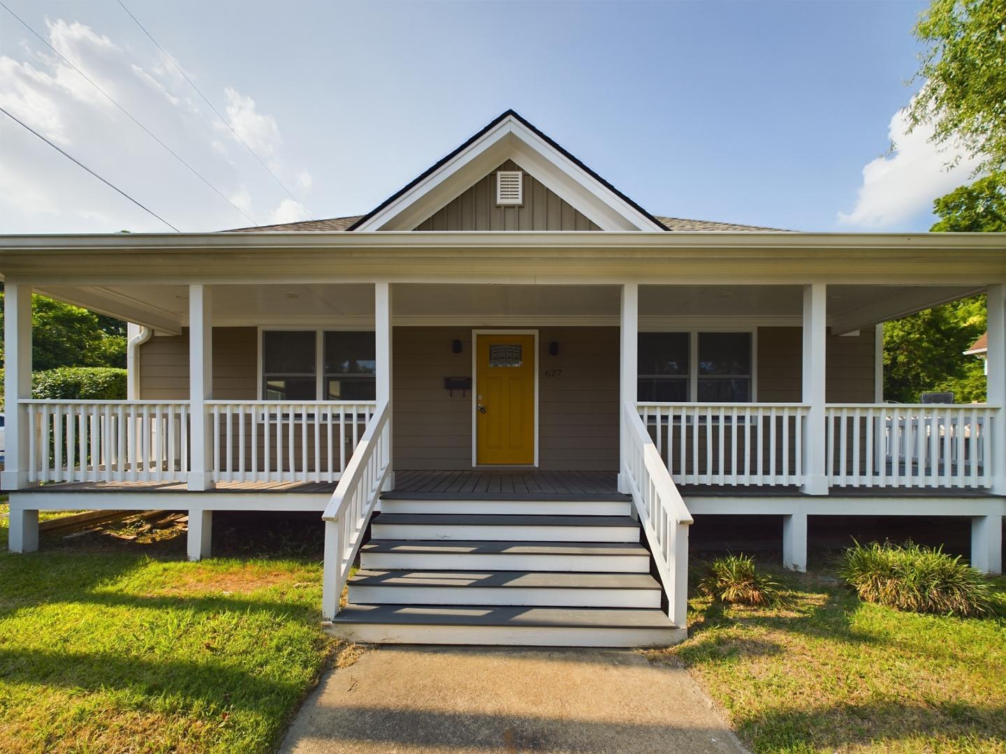 a front view of a house with a deck